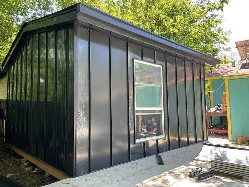 Black standing seam metal wall panels for Roof Inspection in Ralston