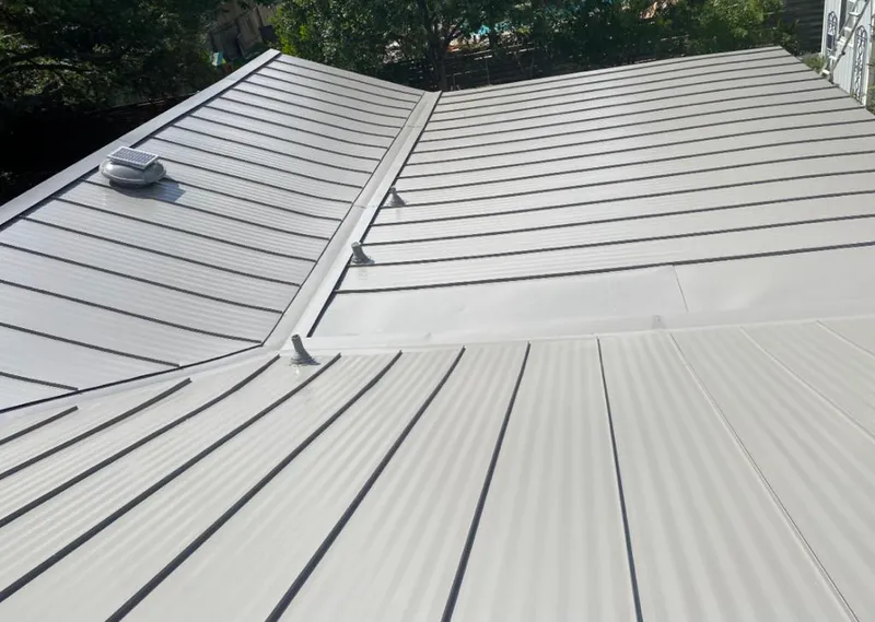 Solar attic fan installed on a metal roof for Roof Ventilation in Ralston